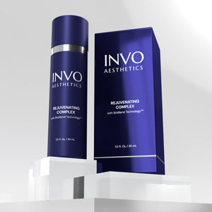 Shiny blue regenerative skincare bottle with box