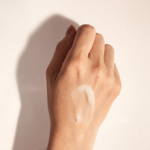Back of hand showing lightweight anti aging skincare serum texture